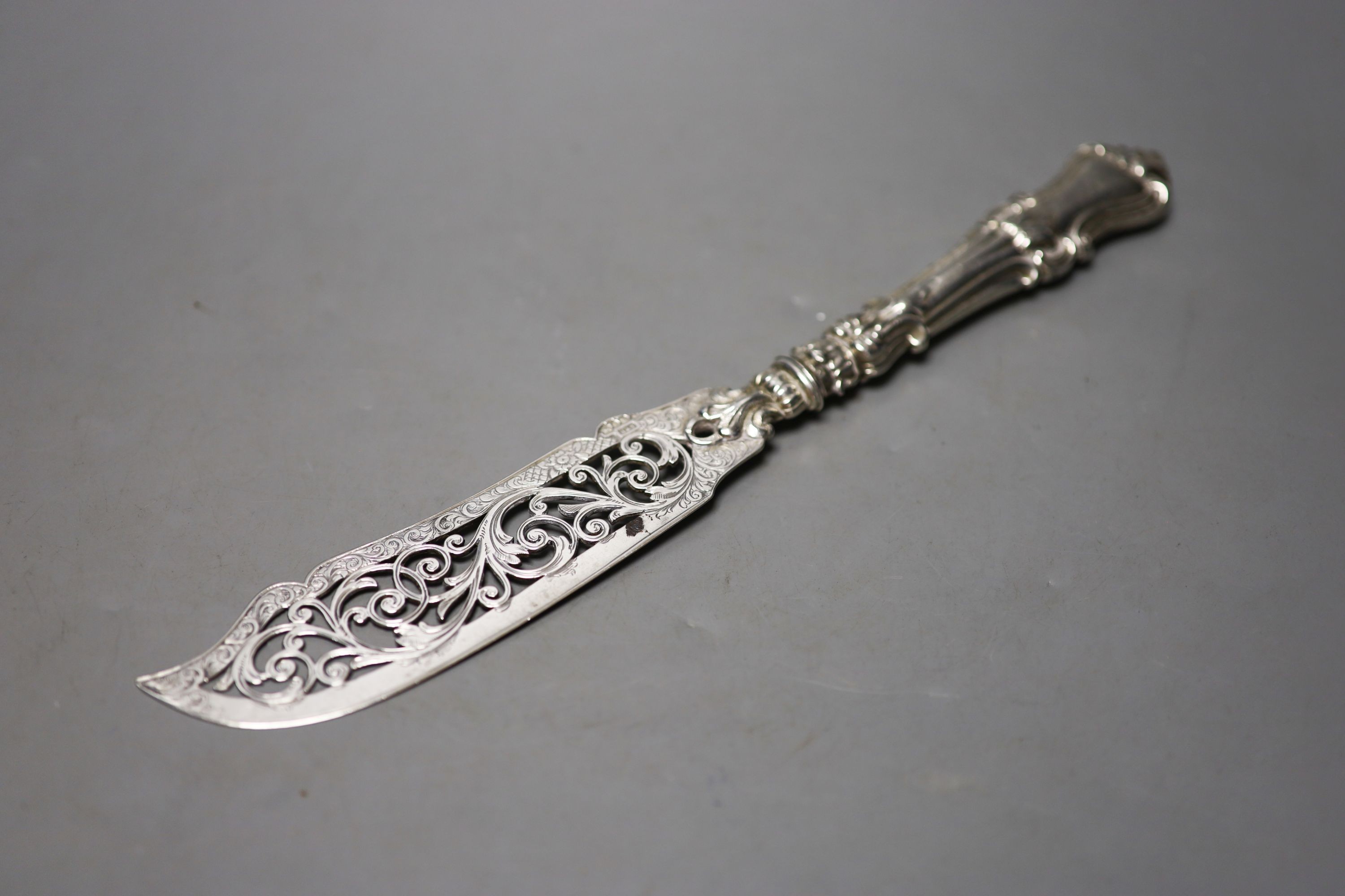 A pair of Victorian pierced silver fish servers, with loaded handles, Hilliard & Thomasson, Birmingham, 1859, knife 32cm.